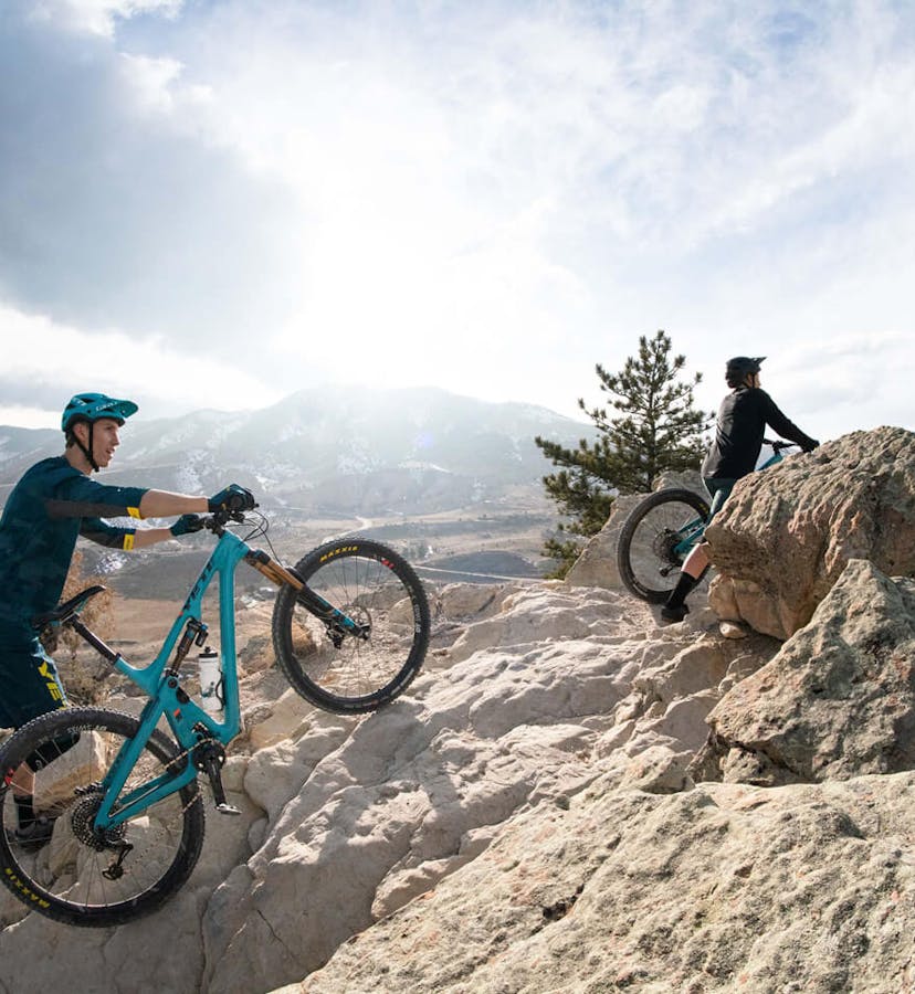 Josh Conroy hiking through rock rubble