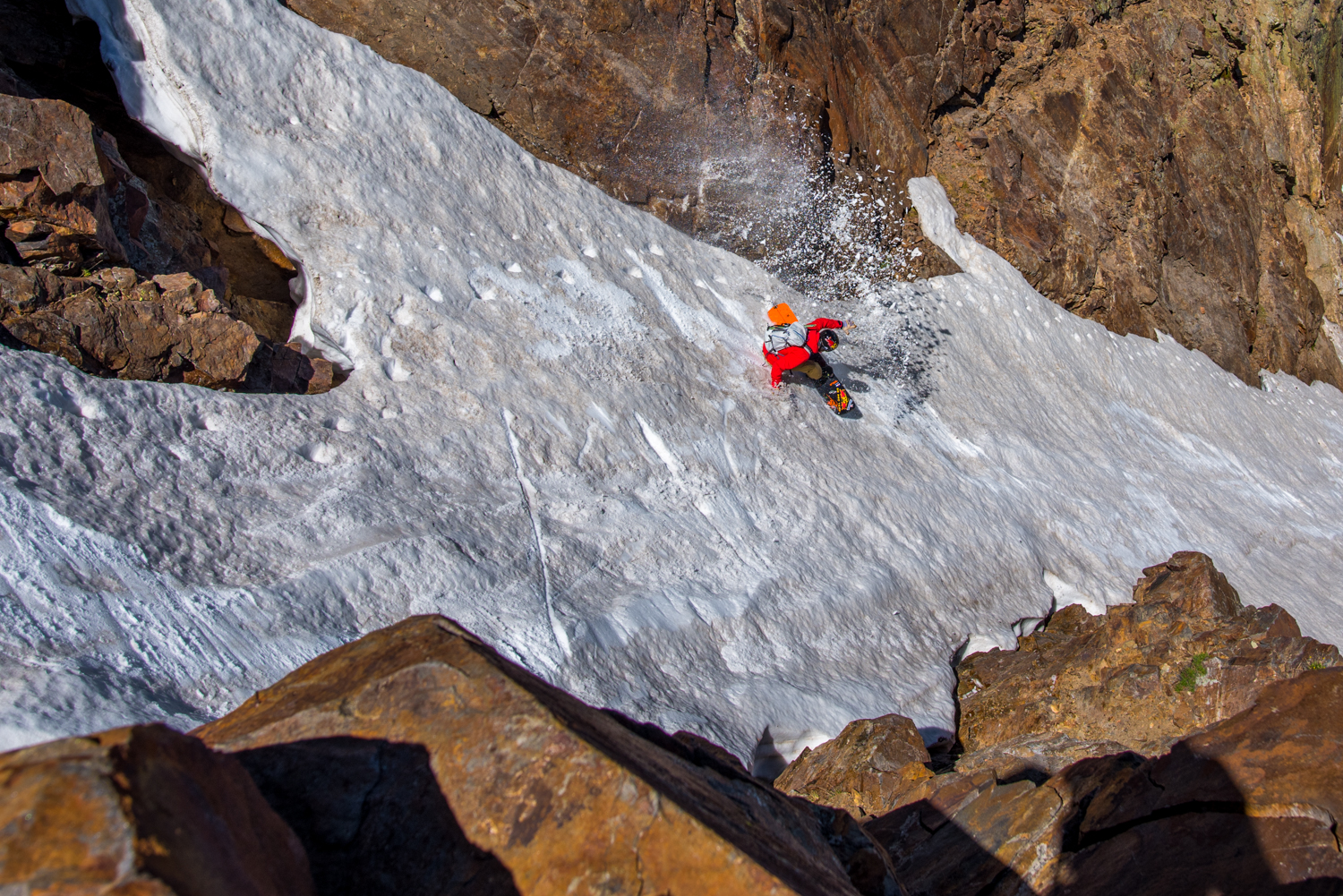 Justin Reiter riding a chute on his snowboard