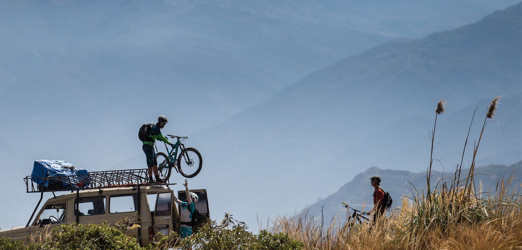 Joey, Thomas, and Carston unloading a truck in Bolivia