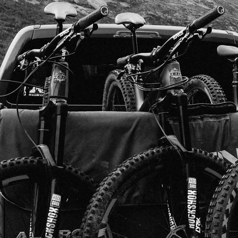 3 bikes on a truck tailgate pad