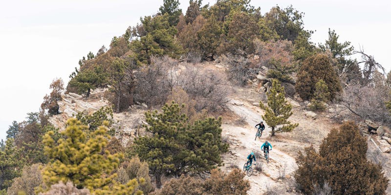 Yeti employees descending Dakota Ridge