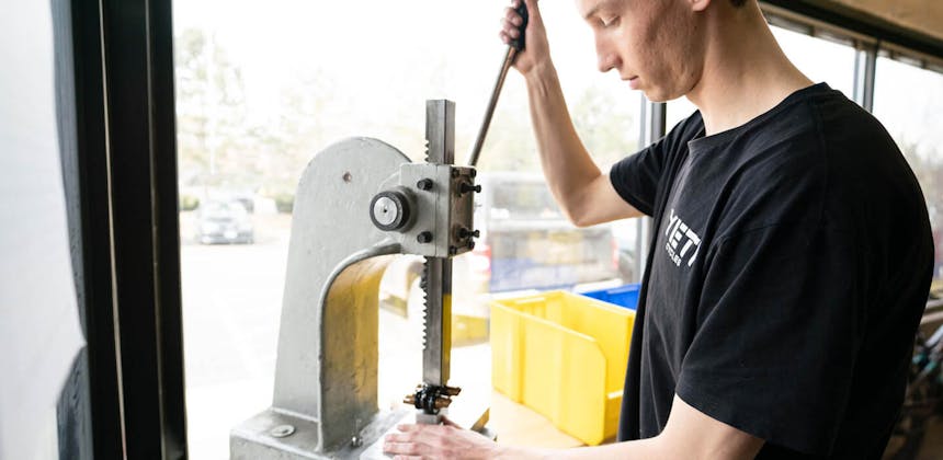 Josh Conroy on the arbor press