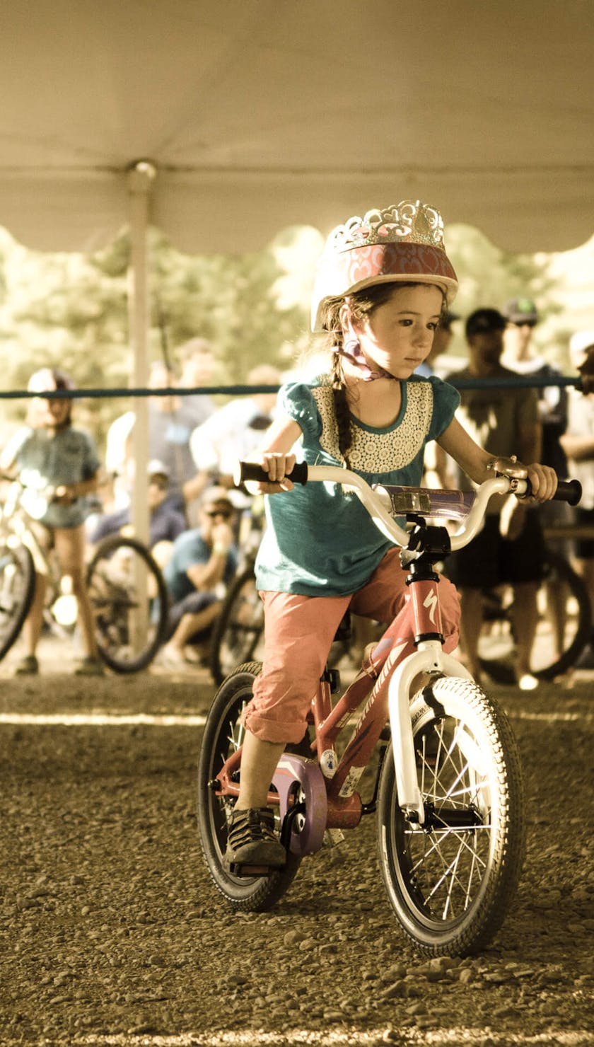 Young girl wearing a crown at the limbo contest