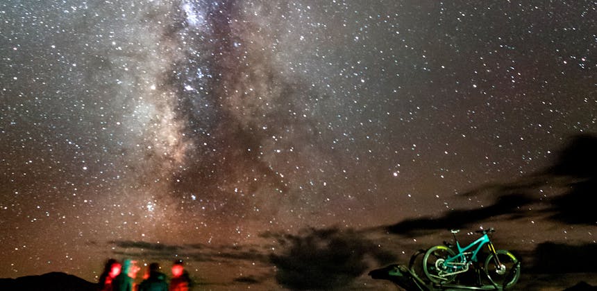 Starry night around a camp fire