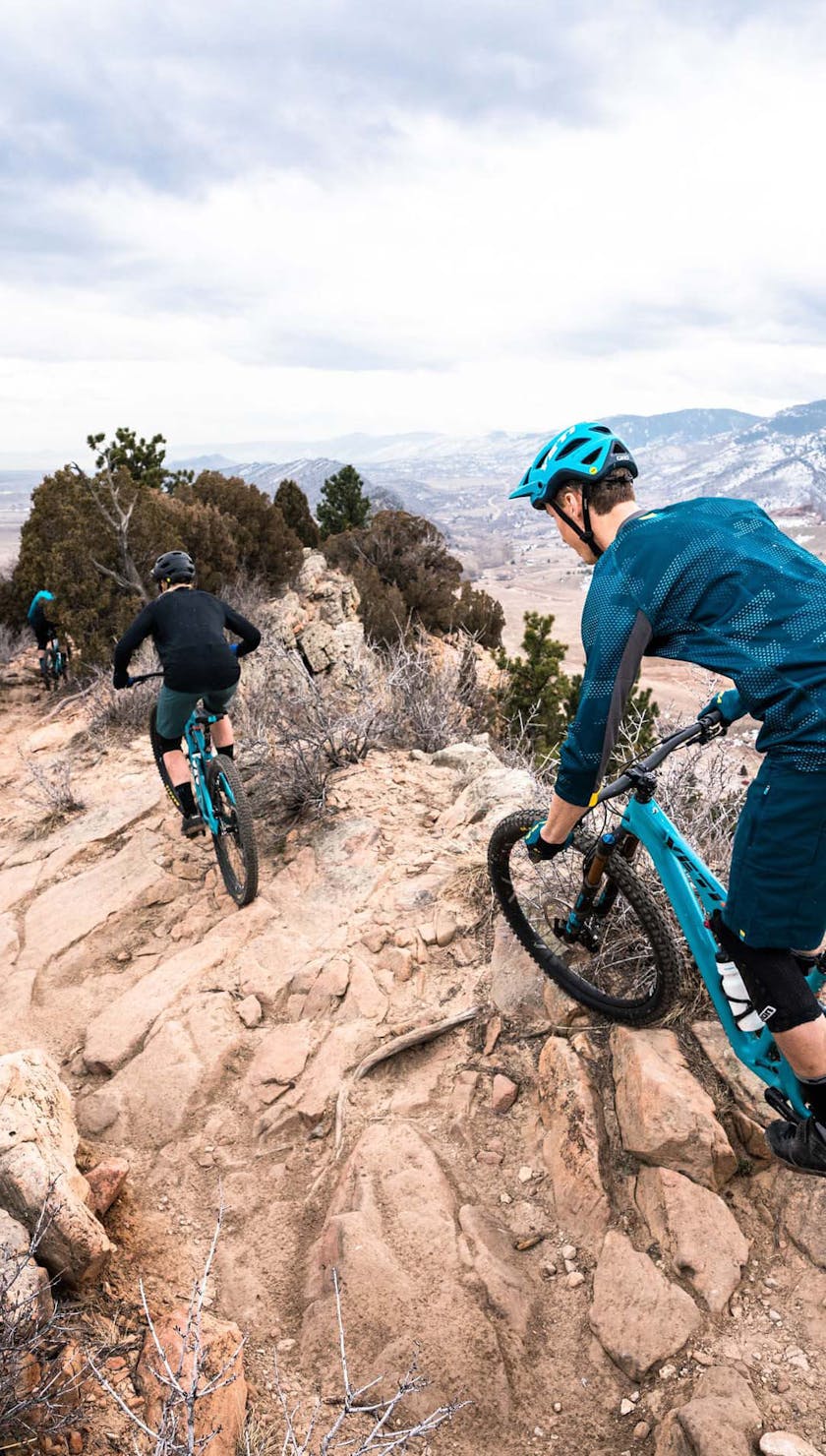 Riders navigating the rocky Dakota Ridge terrain
