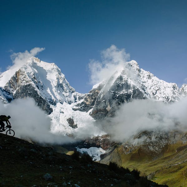 Sam Seward descending with huge peaks in the background