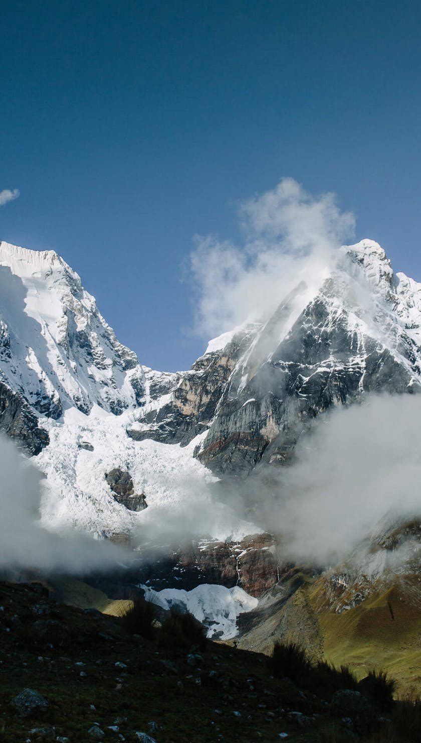 Sam Seward descending with huge peaks in the background
