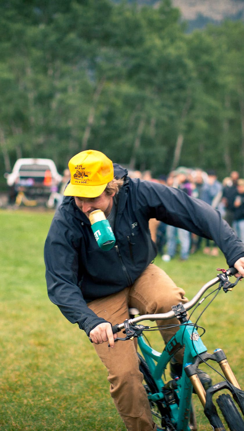 A barrel racer with a beverage in mouth